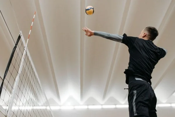 volleyball player jumping serve